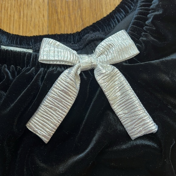 Black velvet puffed sleeve peplum bottom with silver bow accent at the neckline - Picture 2 of 4